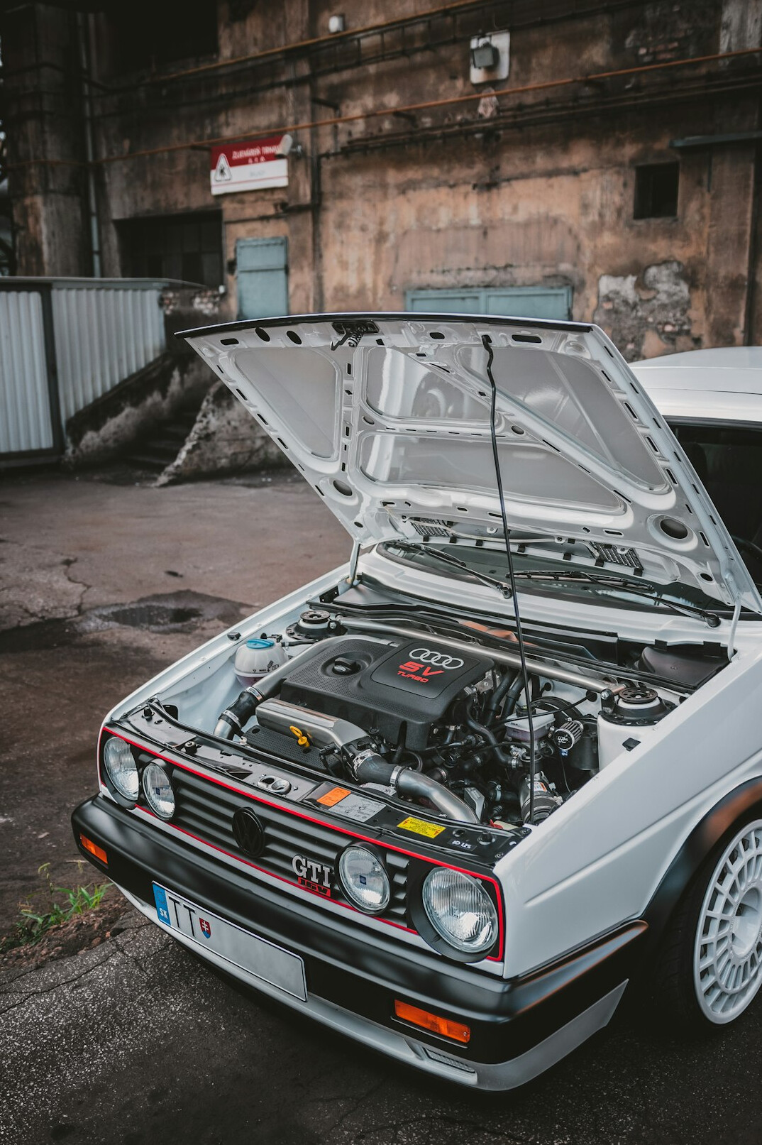Close-up of a car engine bay being serviced