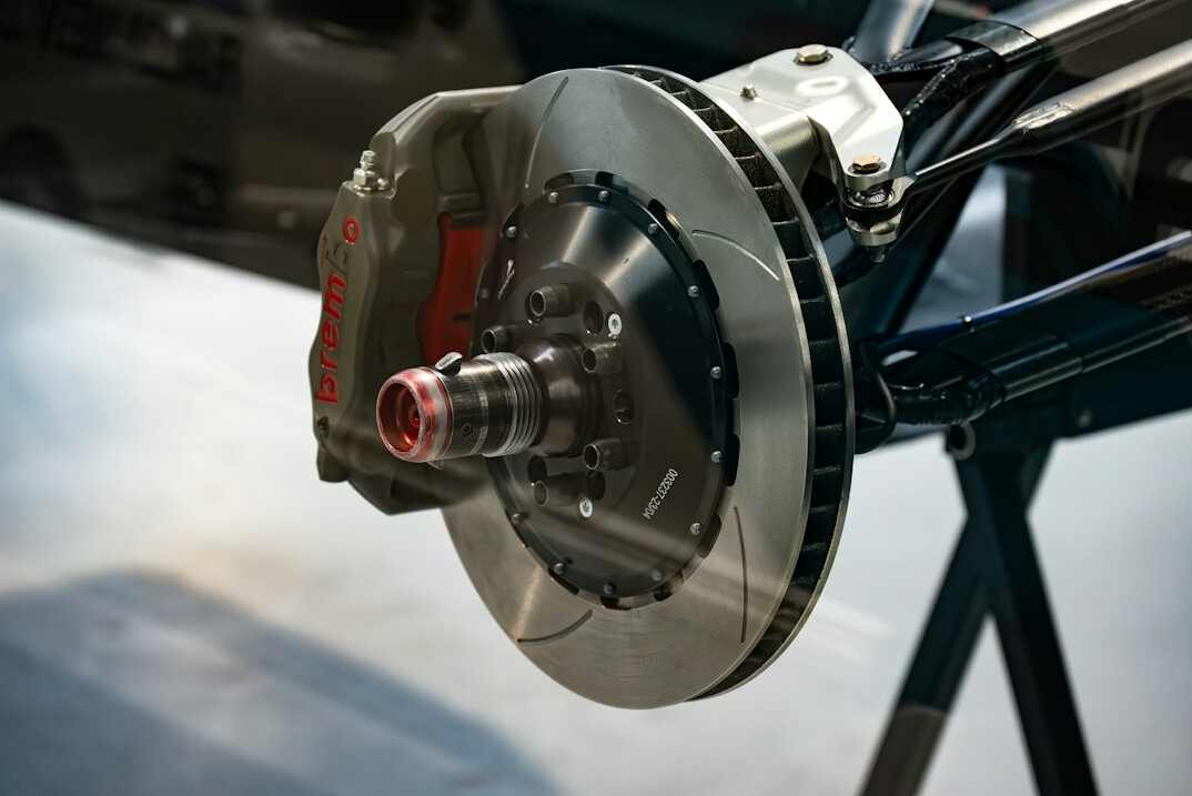 Brake disc and caliper being inspected